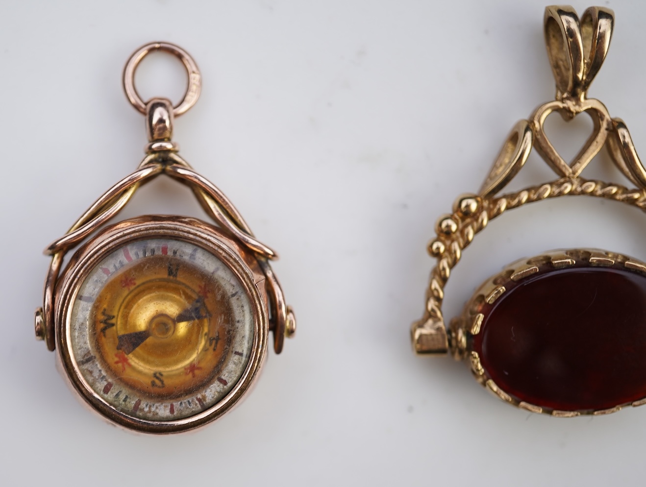 Three 9ct gold fob pendants